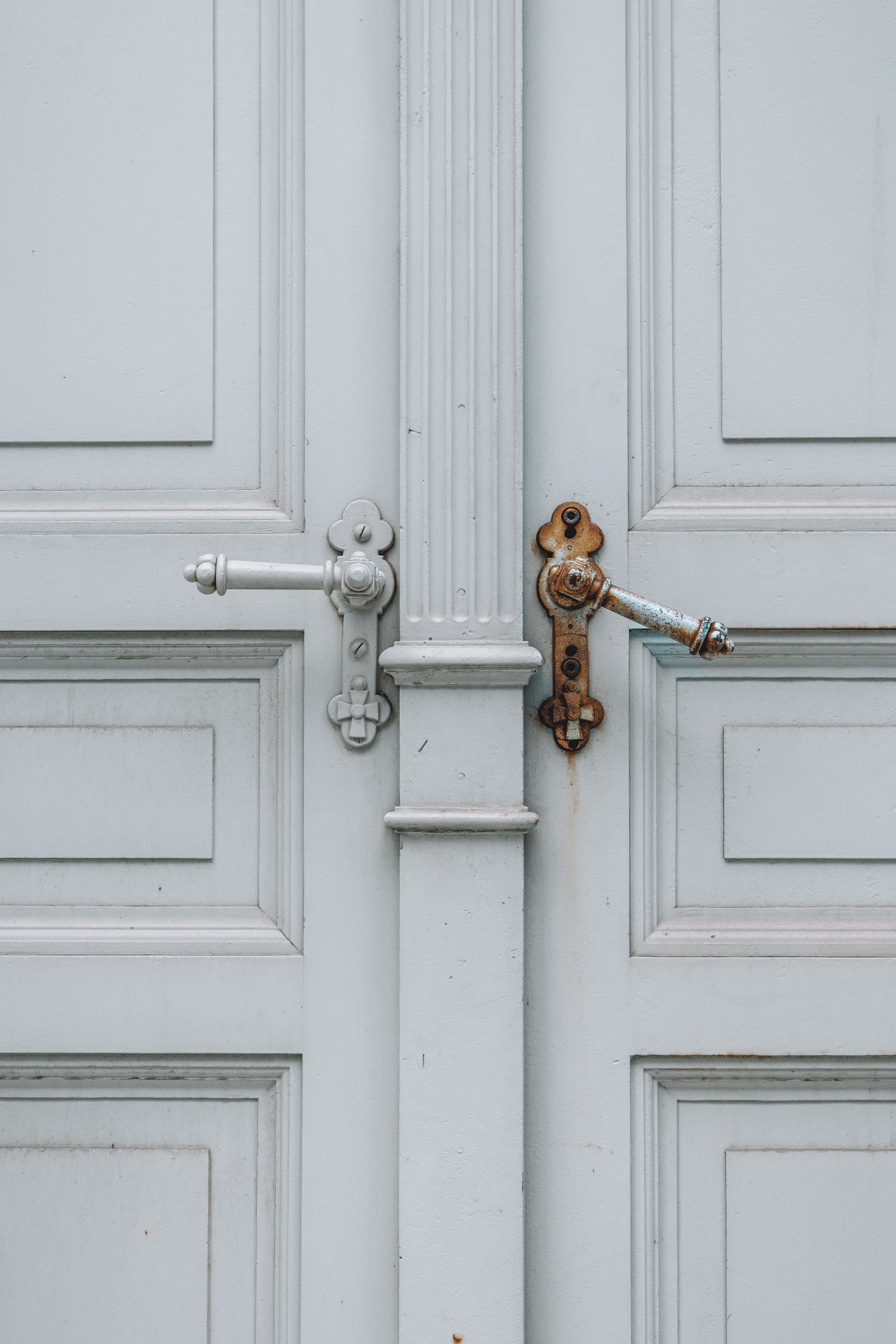 Professional installing a quality wooden door in a residential home